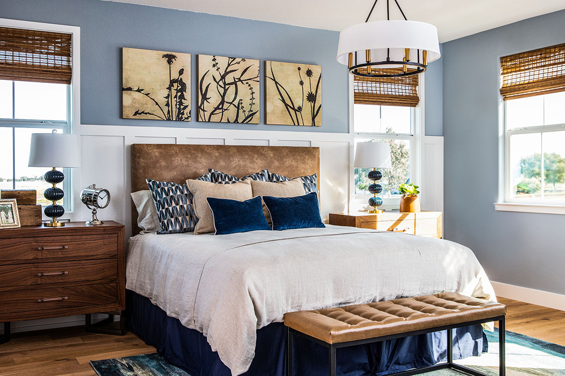 modern bedroom with wood bedroom set furniture and white and blue linen